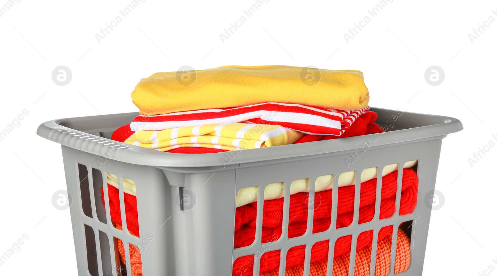 Photo of Plastic laundry basket with clean clothes isolated on white