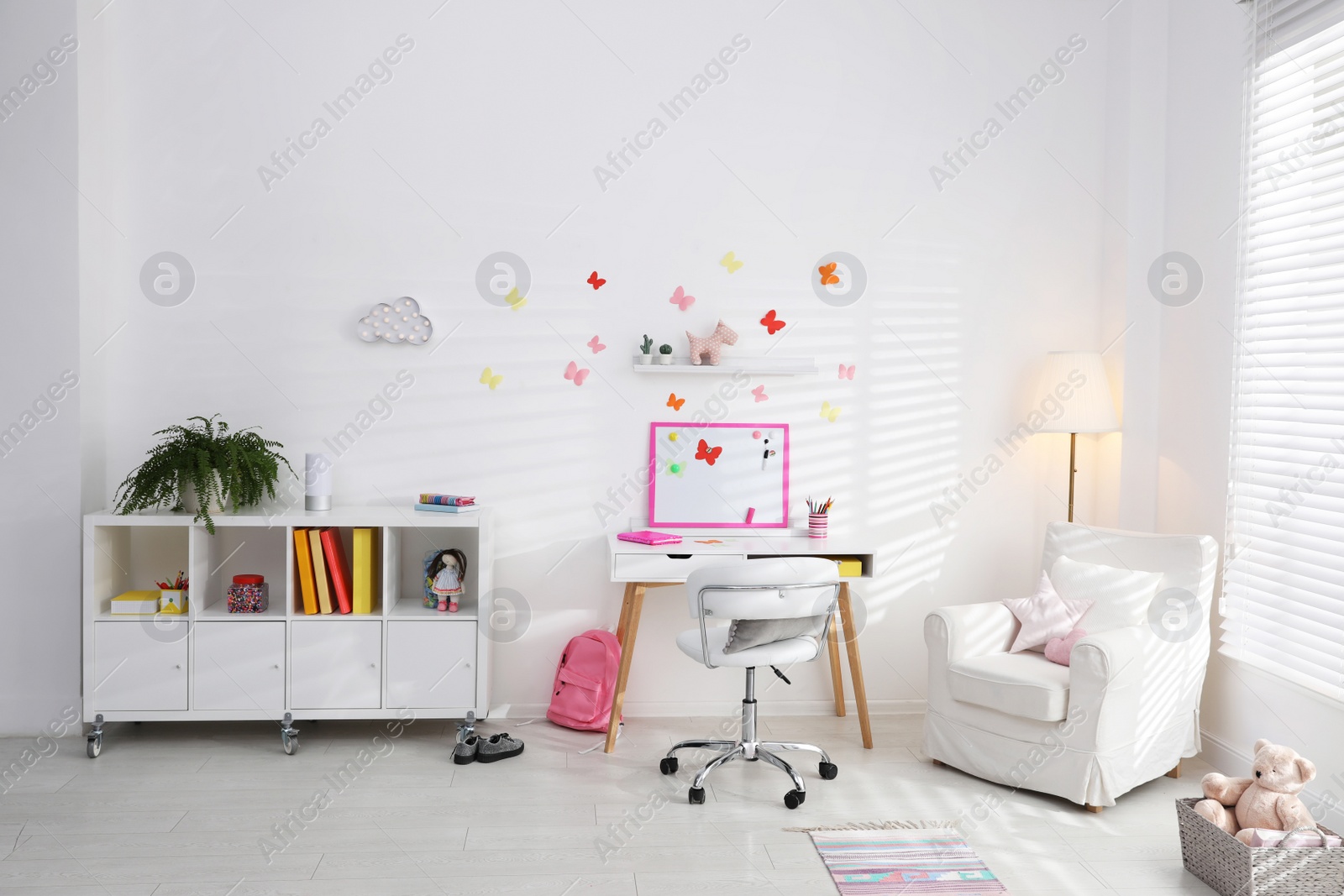 Photo of Modern child room interior with stylish furniture