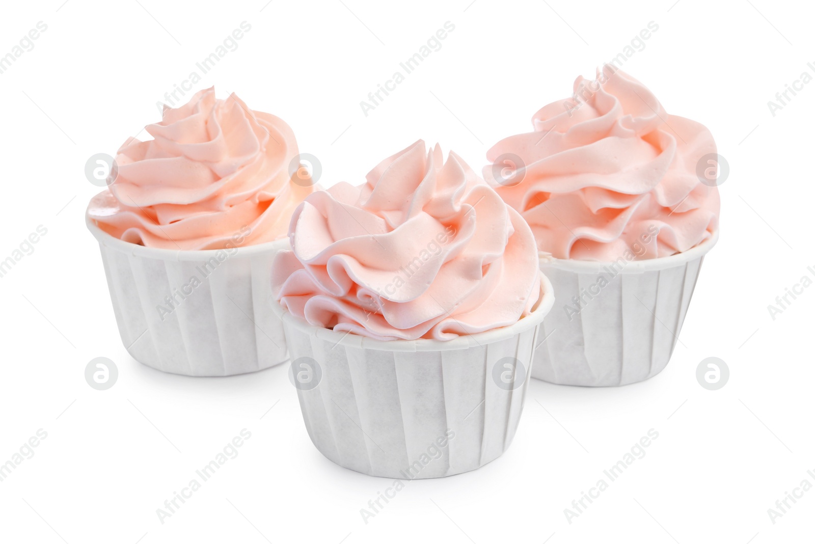 Photo of Tasty cupcakes with cream isolated on white