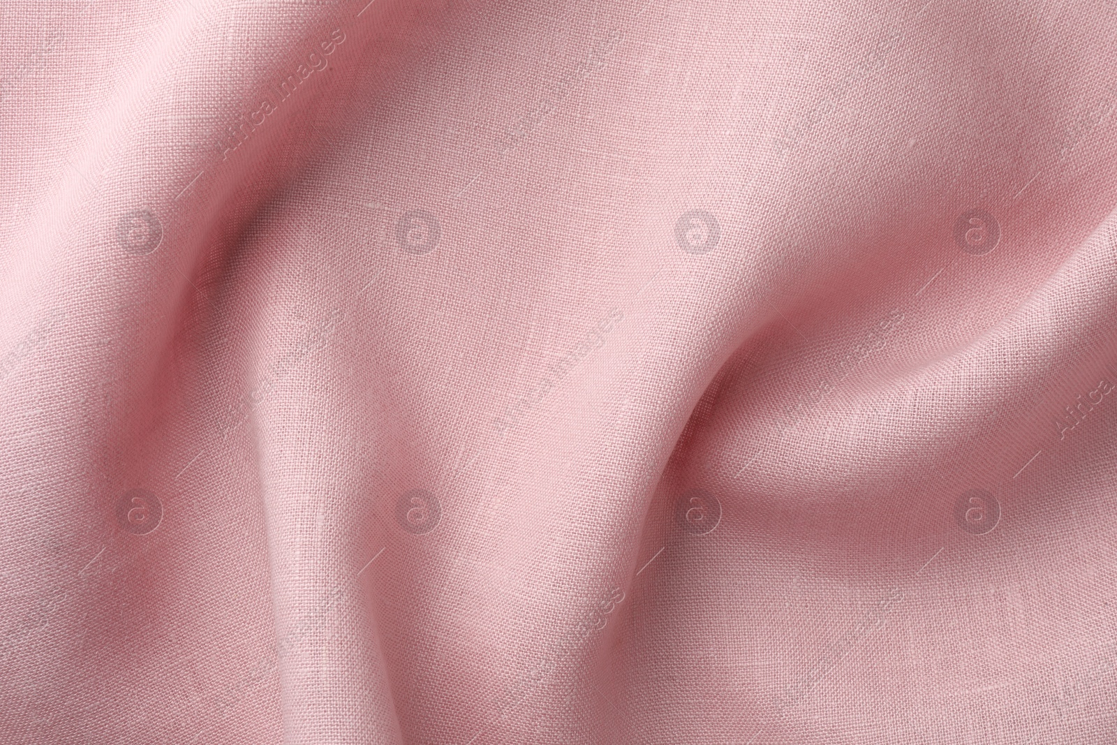 Photo of Texture of pink crumpled fabric as background, top view