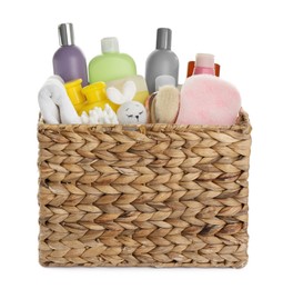 Photo of Wicker basket full of different baby cosmetic products, bathing accessories and toy on white background