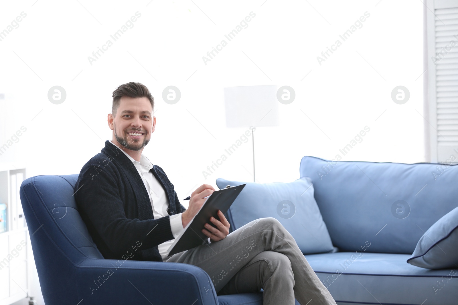Photo of Male psychologist in office