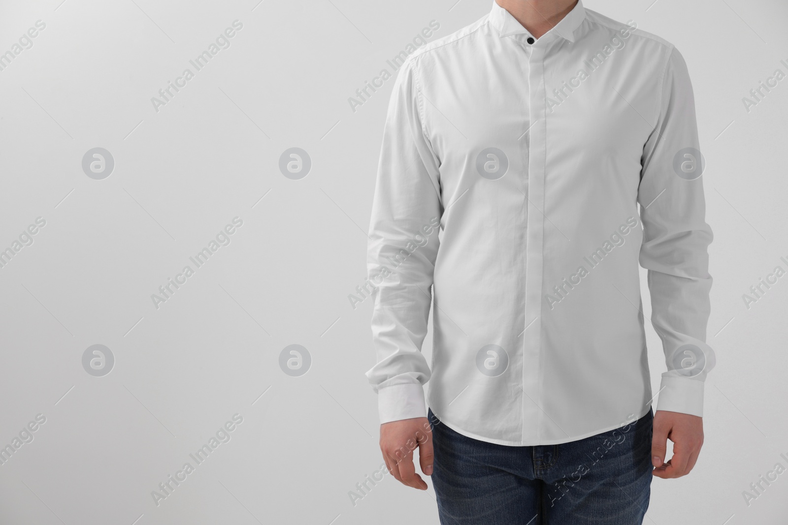 Photo of Man wearing classic shirt on white background, closeup