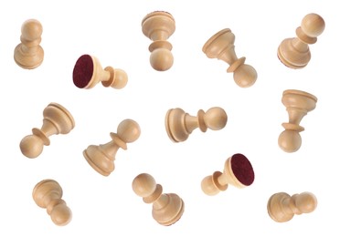 Image of Wooden chess pawns falling on white background