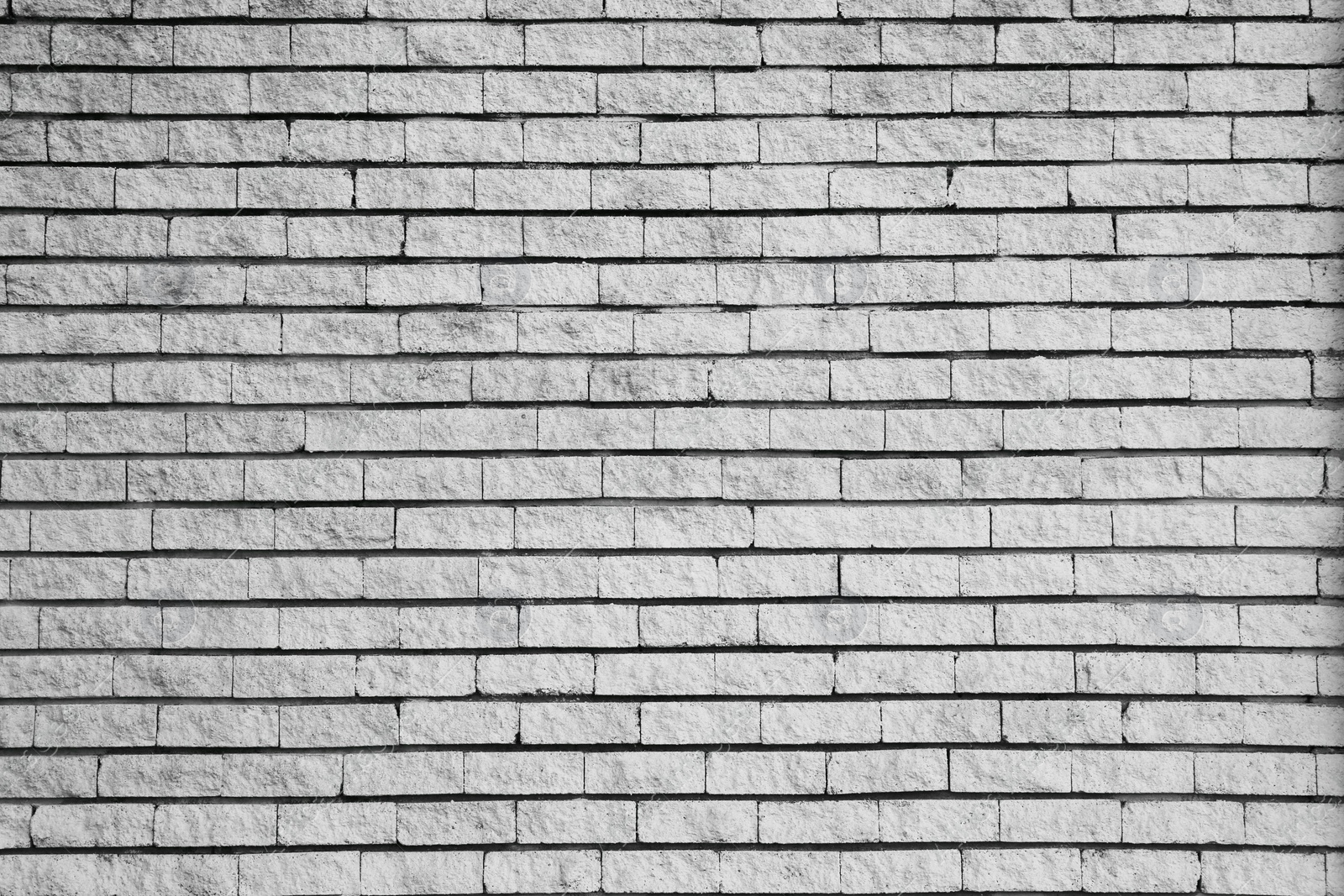 Photo of Texture of grey brick wall as background