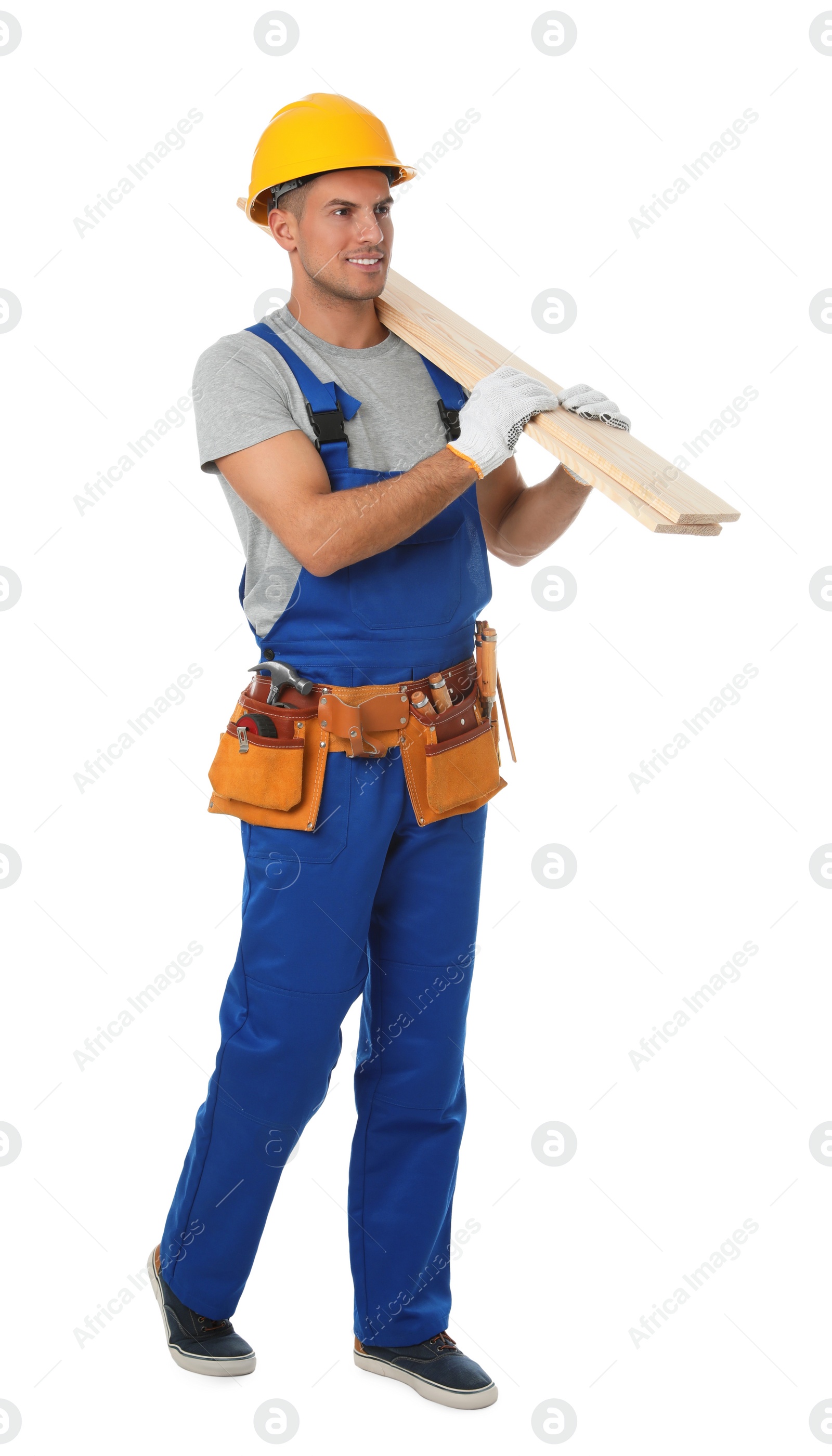 Photo of Handsome carpenter with wooden planks isolated on white