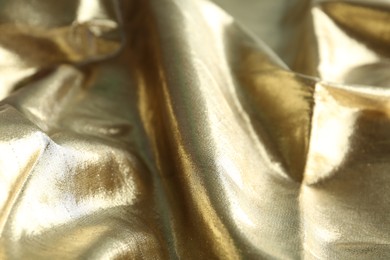 Texture of beautiful golden fabric as background, closeup