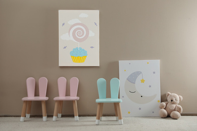 Cute chairs with bunny ears in children's room interior