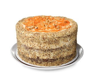 Dish with delicious carrot cake on white background