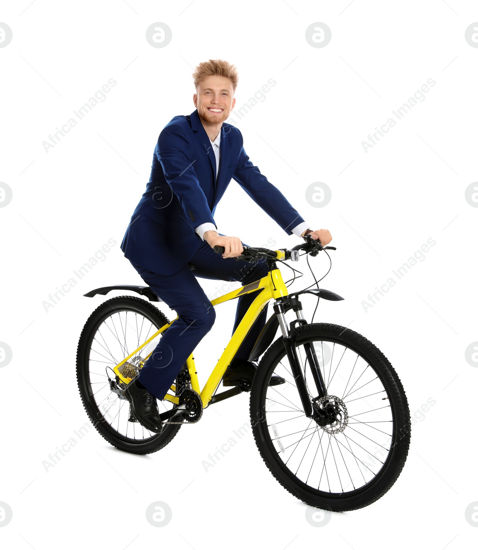 Photo of Young businessman riding bicycle on white background