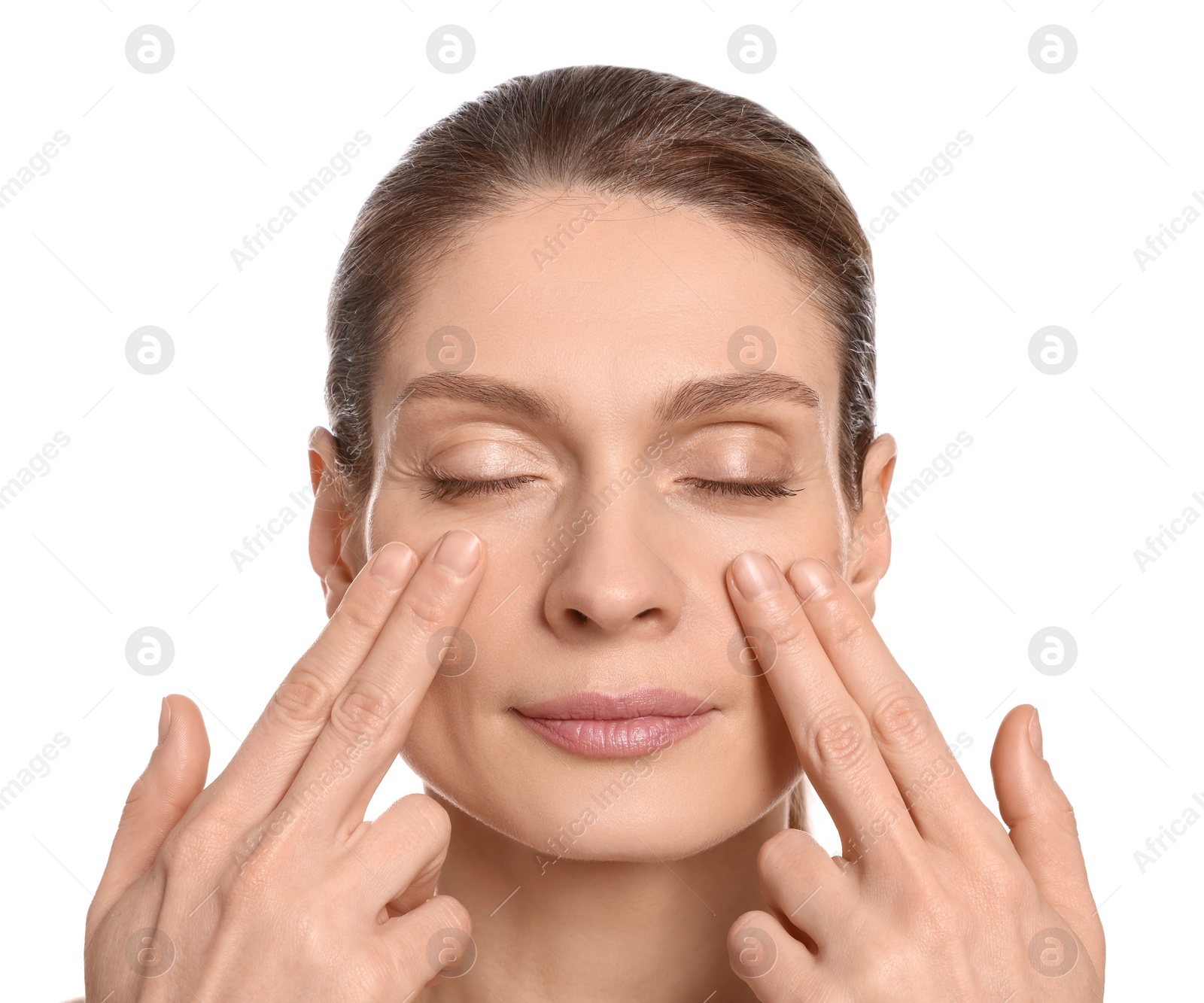 Photo of Woman massaging her face on white background