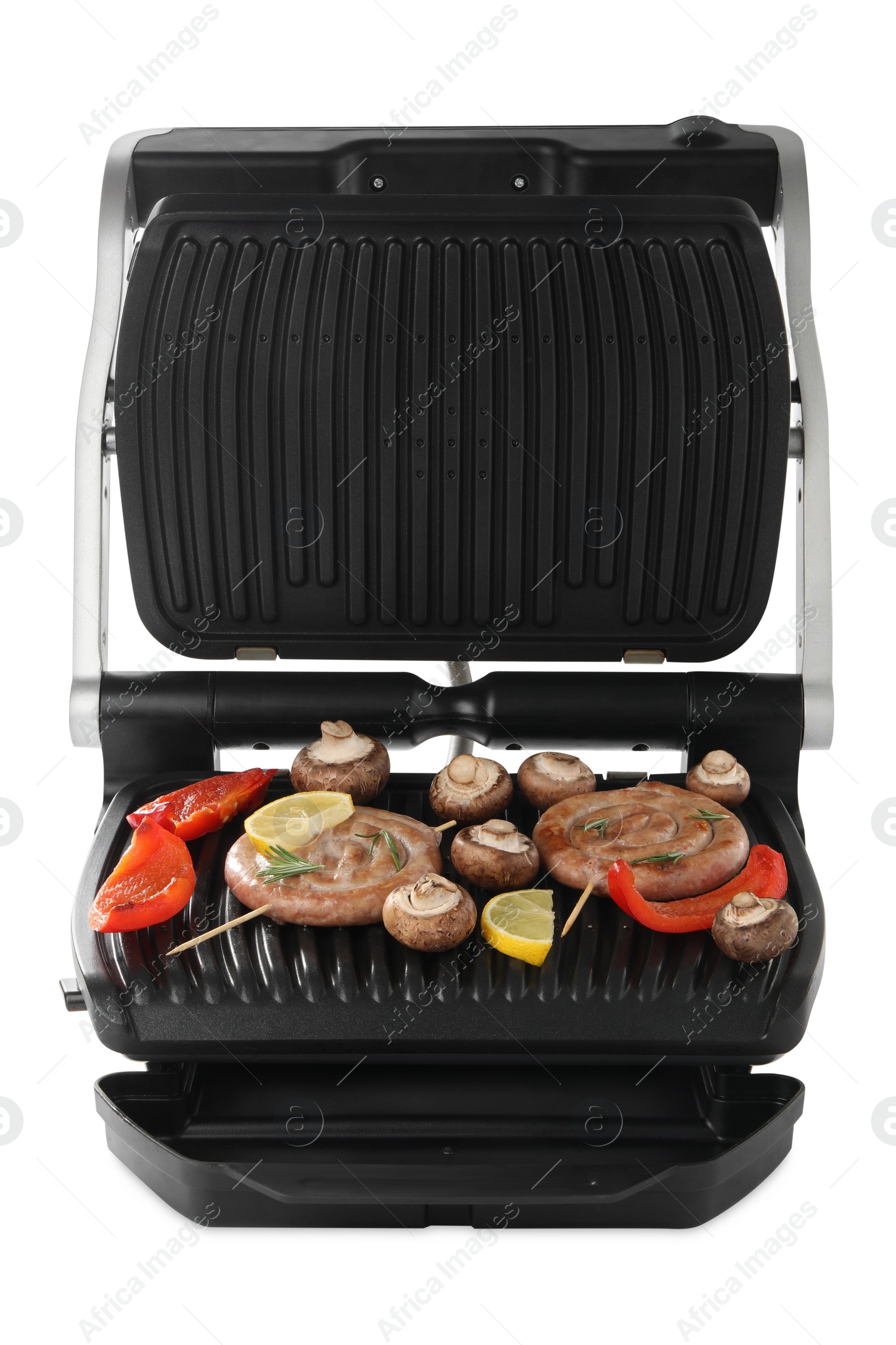 Photo of Electric grill with homemade sausages, mushrooms and bell pepper isolated on white