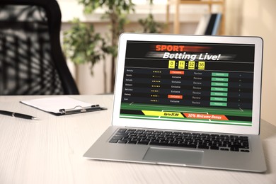 Image of Betting on sports. Laptop with bookmaker site on screen