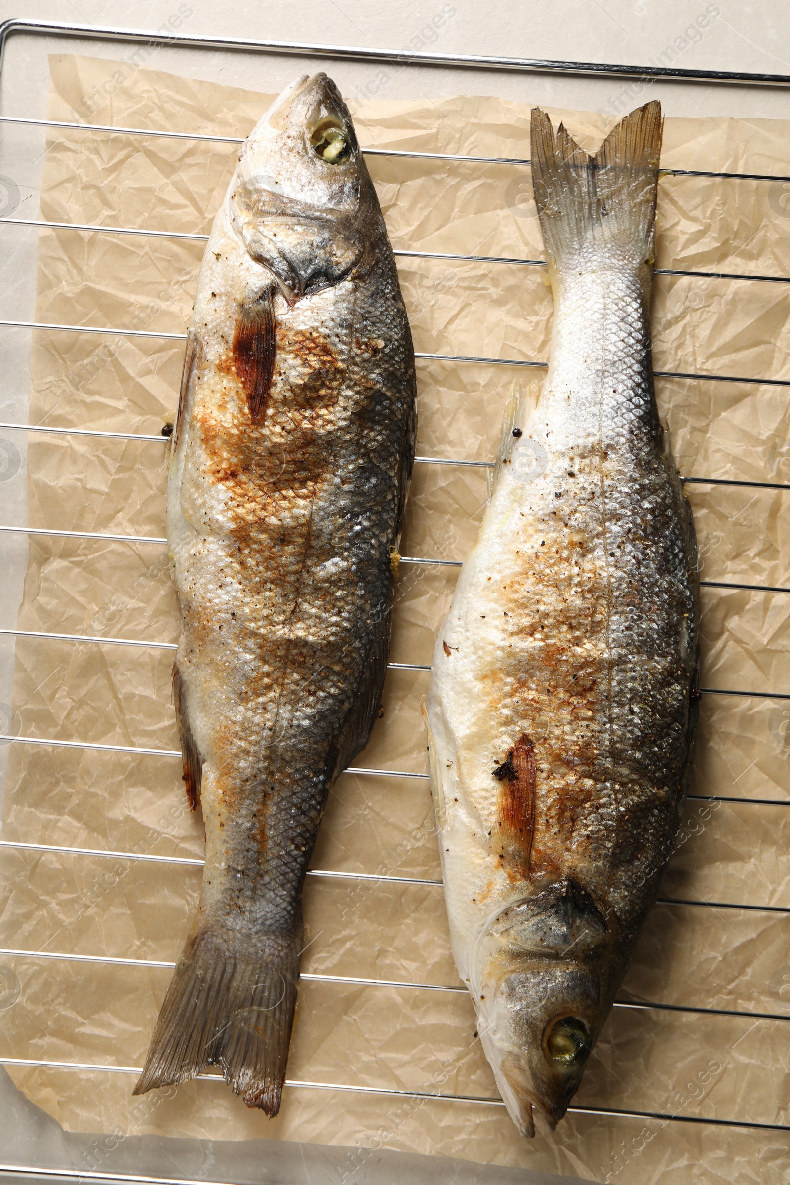 Photo of Baked fish on cooling rack, top view