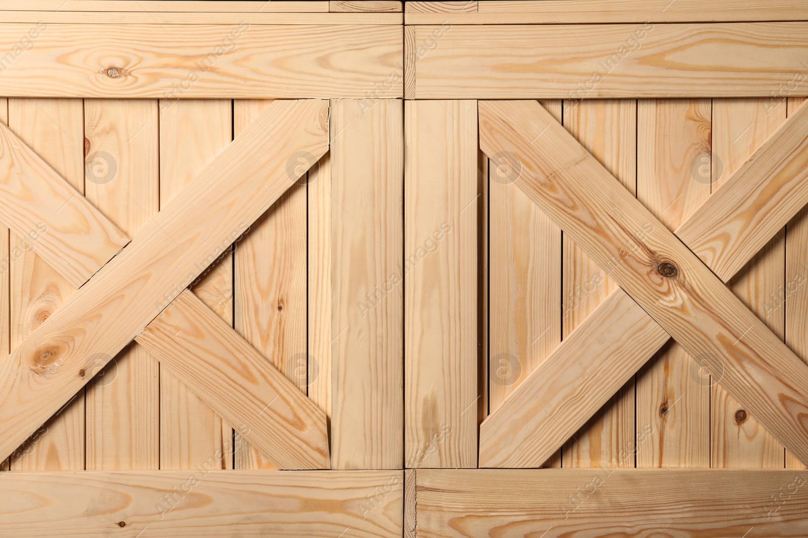 Photo of Wooden crates with crossed planks as background, closeup