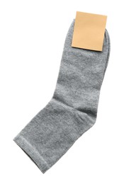 Photo of New pair of grey cotton socks on white background, top view