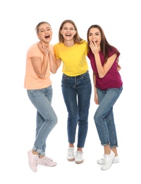 Photo of Full length portrait of young women laughing on white background