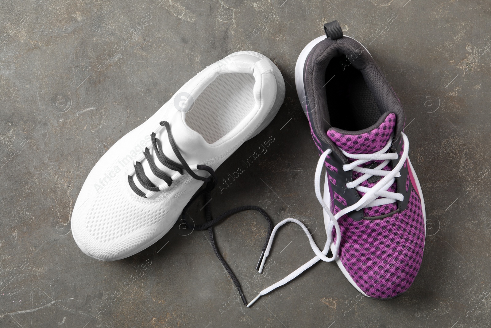 Photo of Pair of stylish shoes with laces on grey background, flat lay