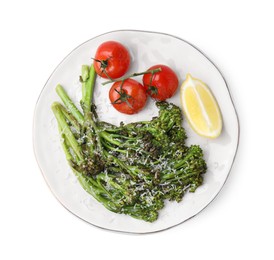 Tasty cooked broccolini with cheese, tomatoes and lemon isolated on white, top view