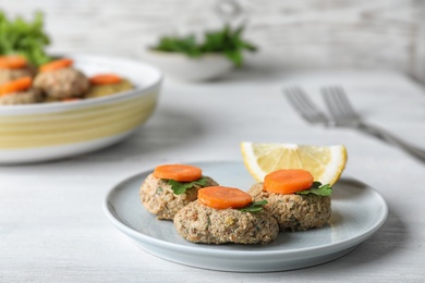 Plate of traditional Passover (Pesach) gefilte fish on table