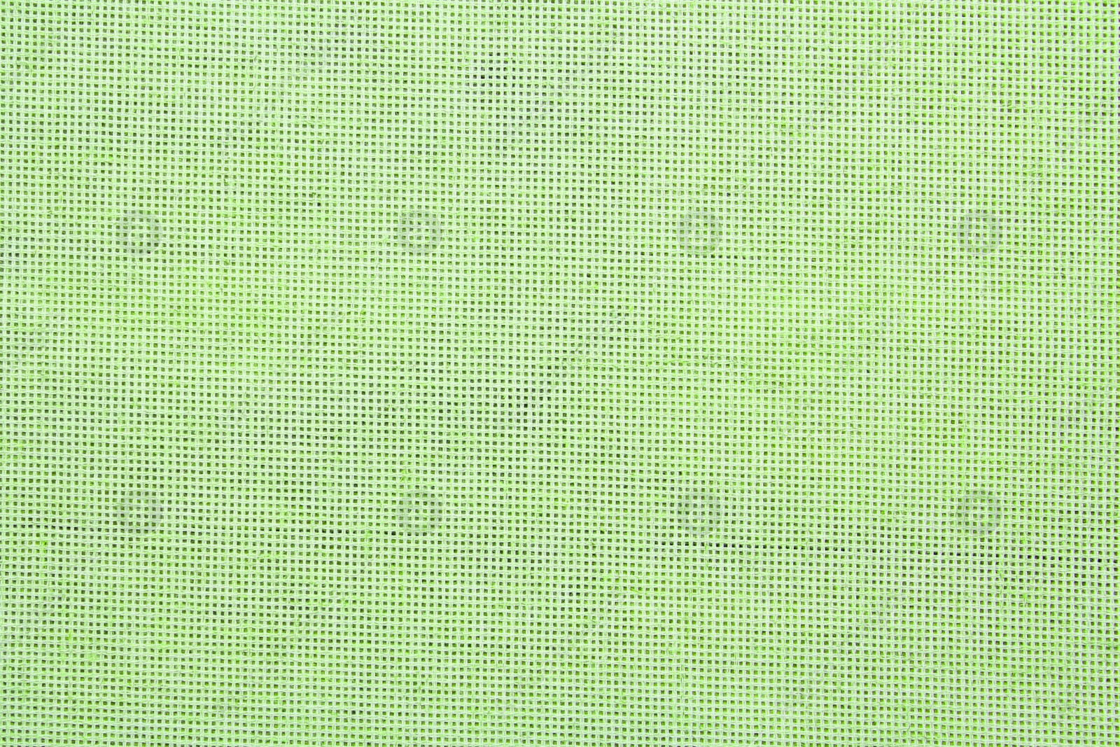 Image of Texture of light green burlap fabric as background, top view