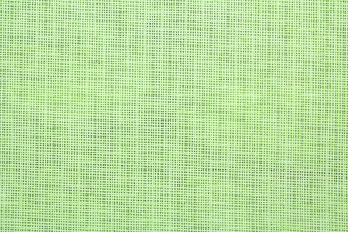 Texture of light green burlap fabric as background, top view