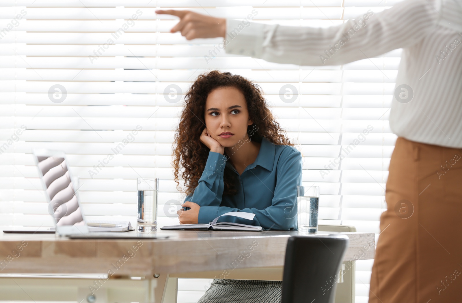 Photo of African American woman suffering from racial discrimination at work