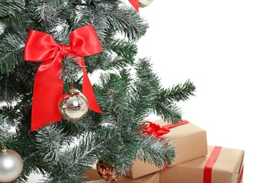 Photo of Beautiful Christmas tree with decor on white background, closeup. Celebration time