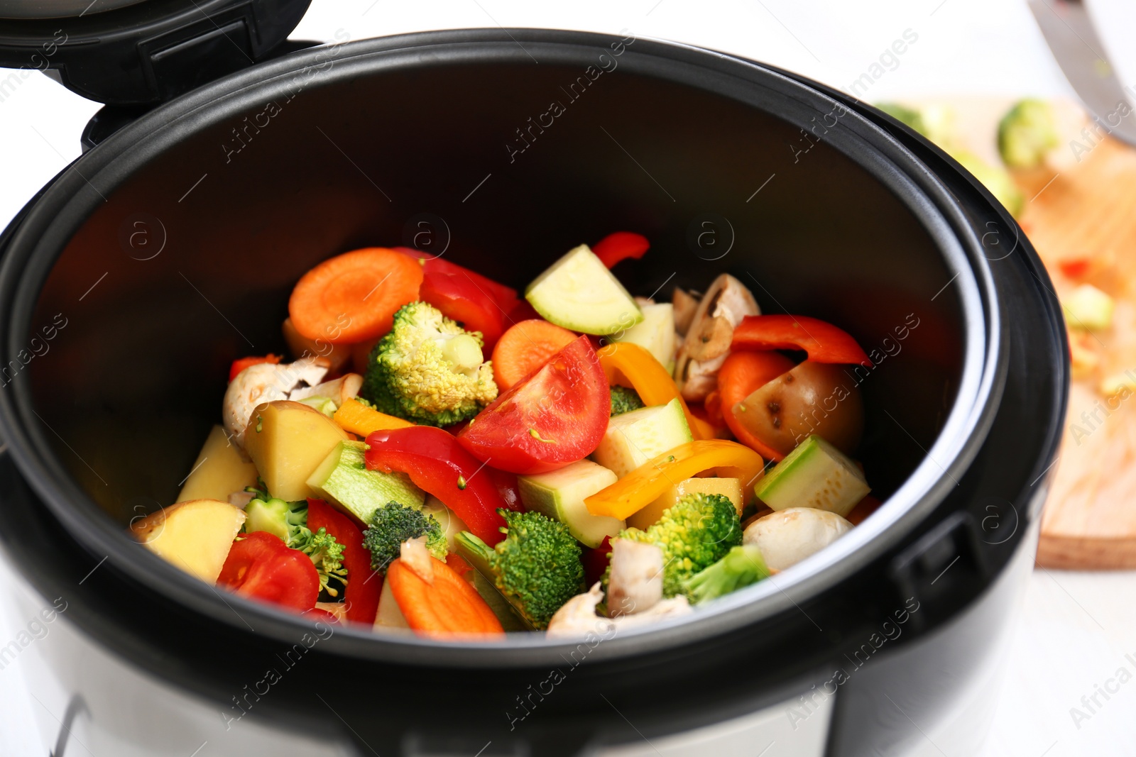 Photo of Closeup view of multi cooker with vegetables