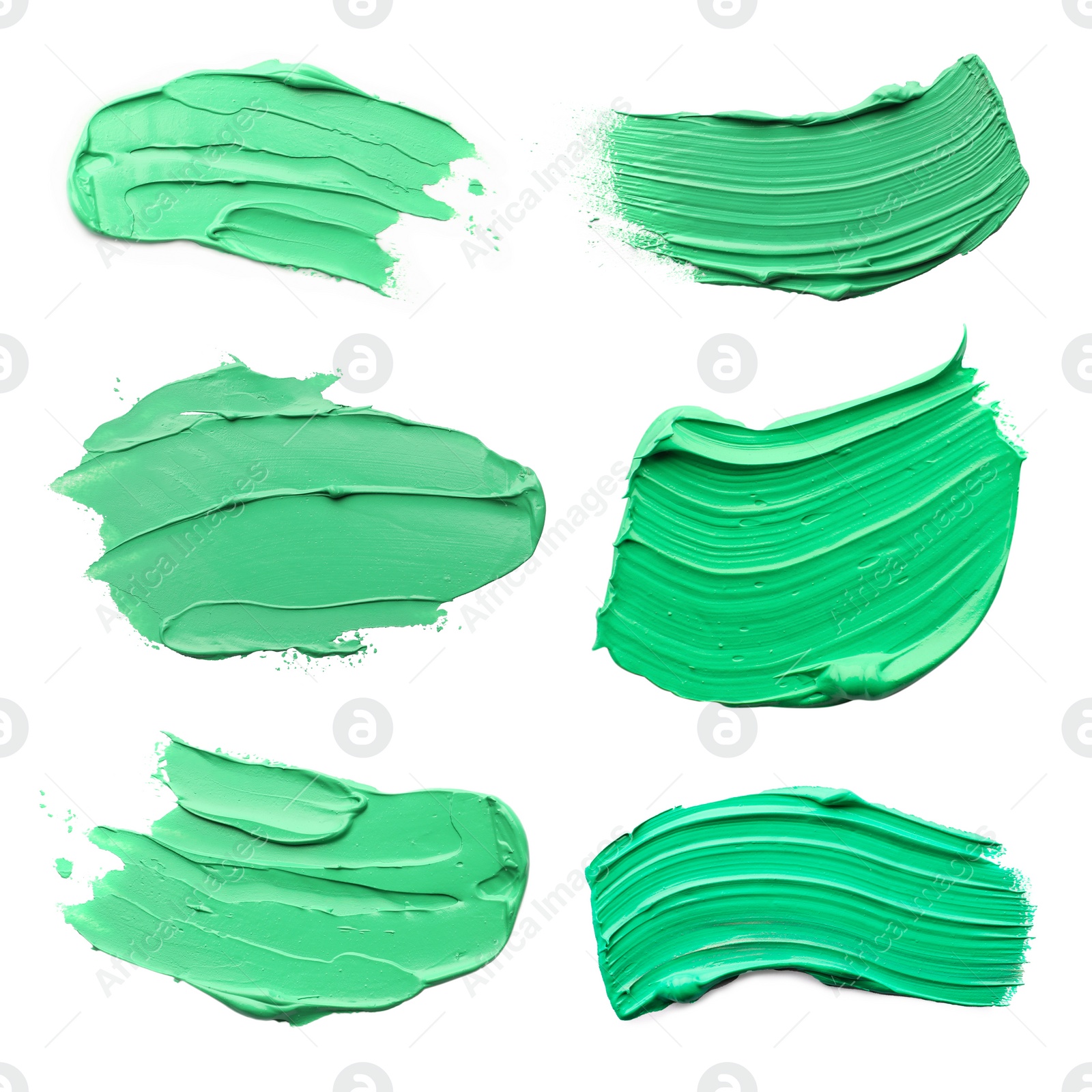 Image of Light green oil paint strokes isolated on white, top view