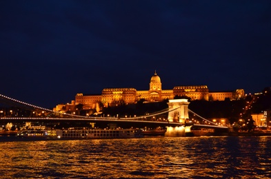 Photo of BUDAPEST, HUNGARY - JUNE 17, 2018: Picturesque view of Danube river, Chain Bridge and Royal Palace at night
