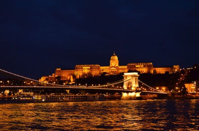 BUDAPEST, HUNGARY - JUNE 17, 2018: Picturesque view of Danube river, Chain Bridge and Royal Palace at night