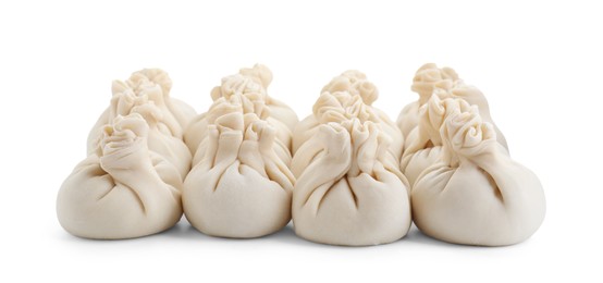 Uncooked khinkali (dumplings) isolated on white. Georgian cuisine