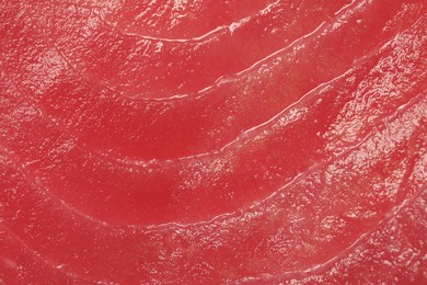 Photo of Fresh raw tuna fillet as background, top view