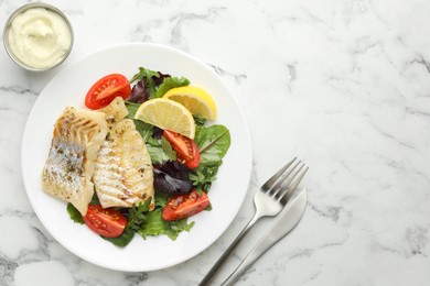 Tasty cod cooked served with salad on white marble table, flat lay. Space for text