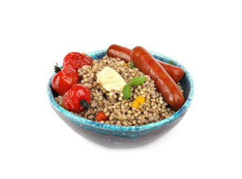 Tasty buckwheat porridge with sausages and vegetables isolated on white