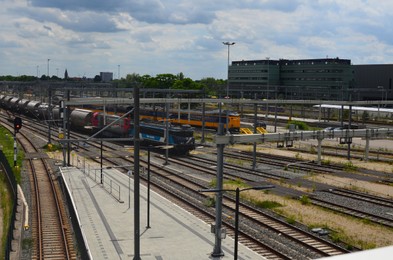 Railway lines and modern trains on sunny day