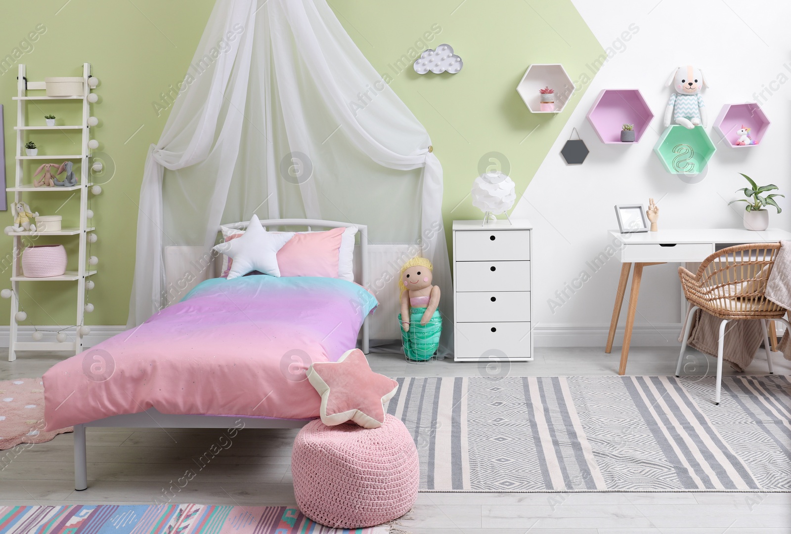 Photo of Cute child's room interior with toys and modern furniture