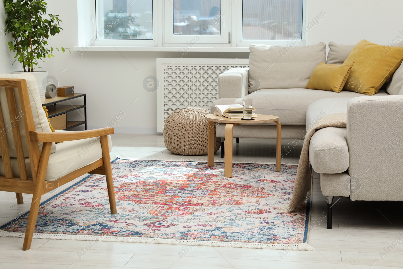 Photo of Stylish living room with beautiful carpet and furniture. Interior design