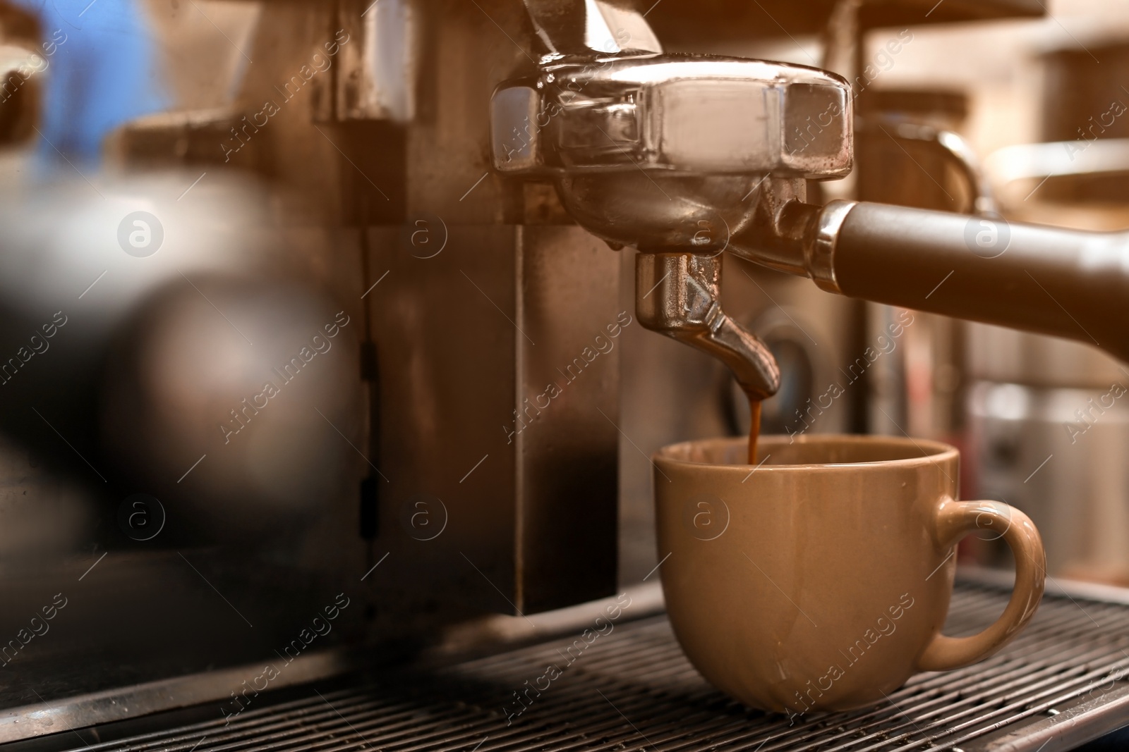 Photo of Preparing fresh aromatic coffee using modern machine, closeup