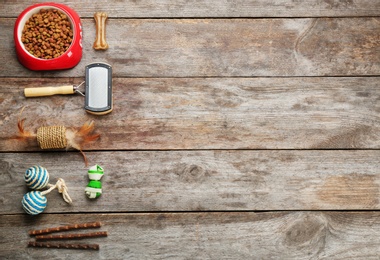 Photo of Flat lay composition with cat accessories and food on wooden background