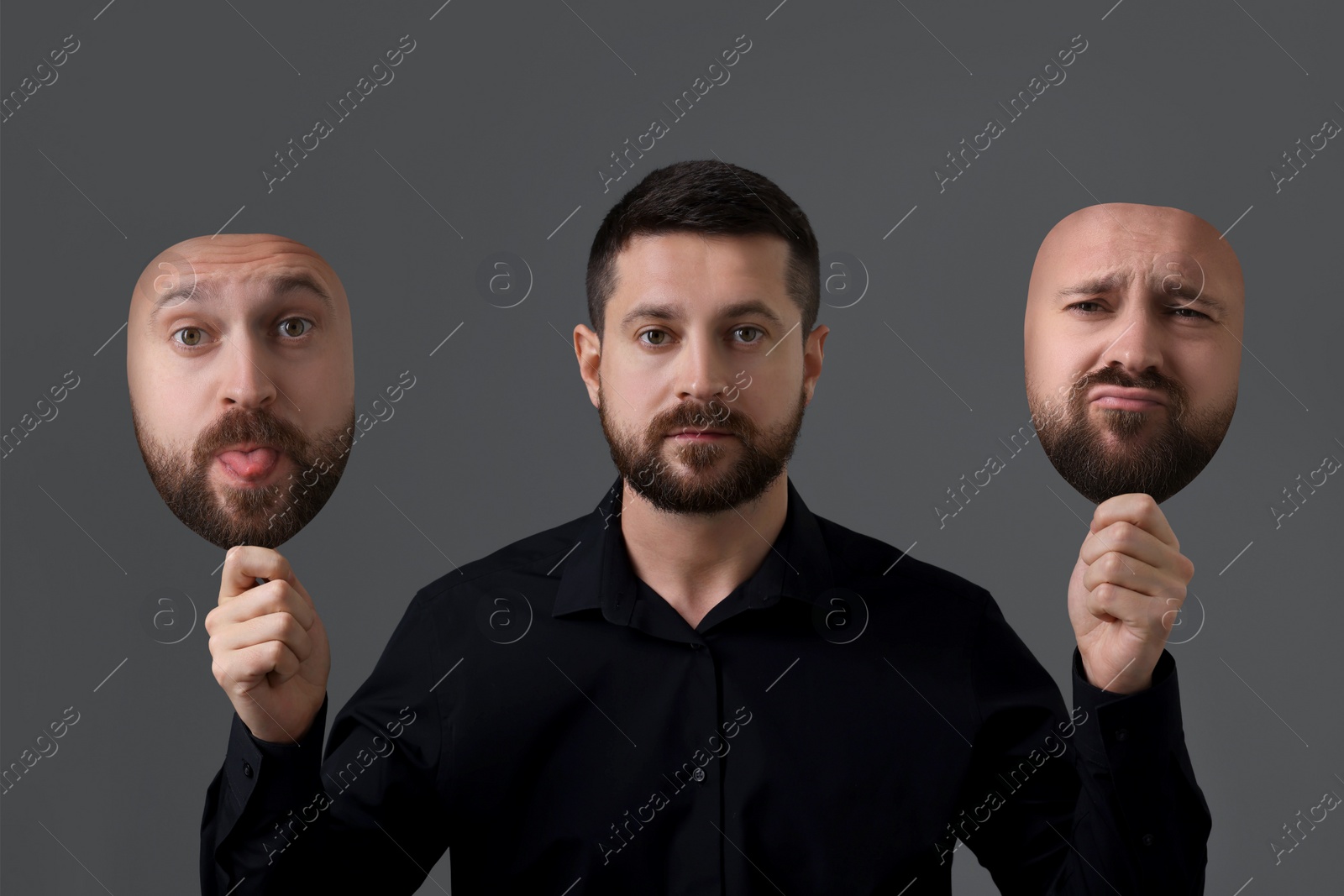 Image of Man holding masks with his face showing different emotions on grey background. Balanced personality