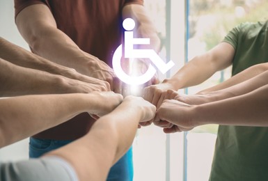 Image of Inclusion concept. International symbol of access. People holding hands together, closeup