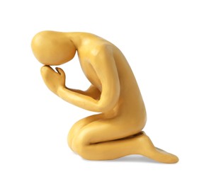 Photo of Plasticine figure of praying human isolated on white