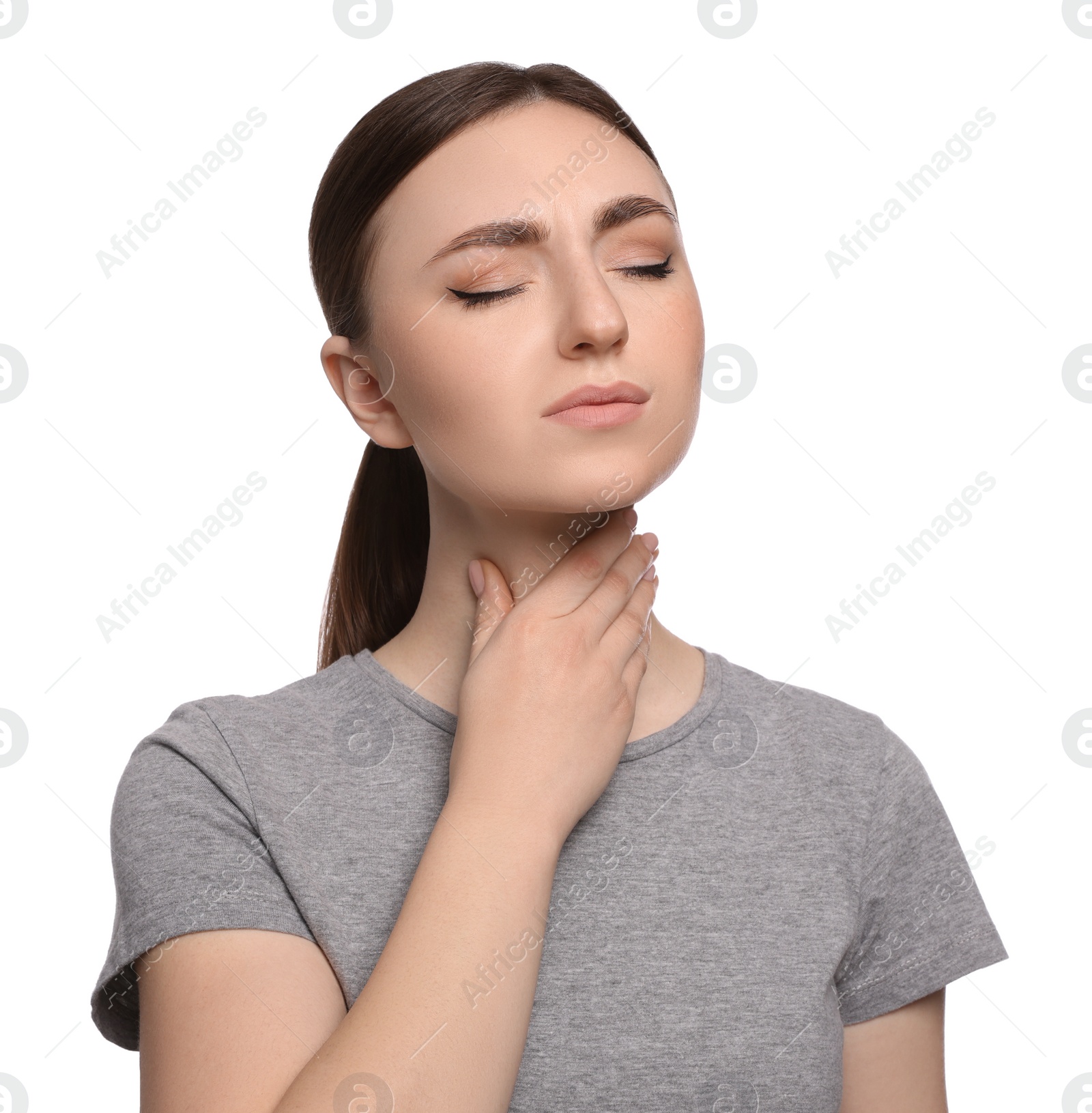 Photo of Young woman with sore throat on white background
