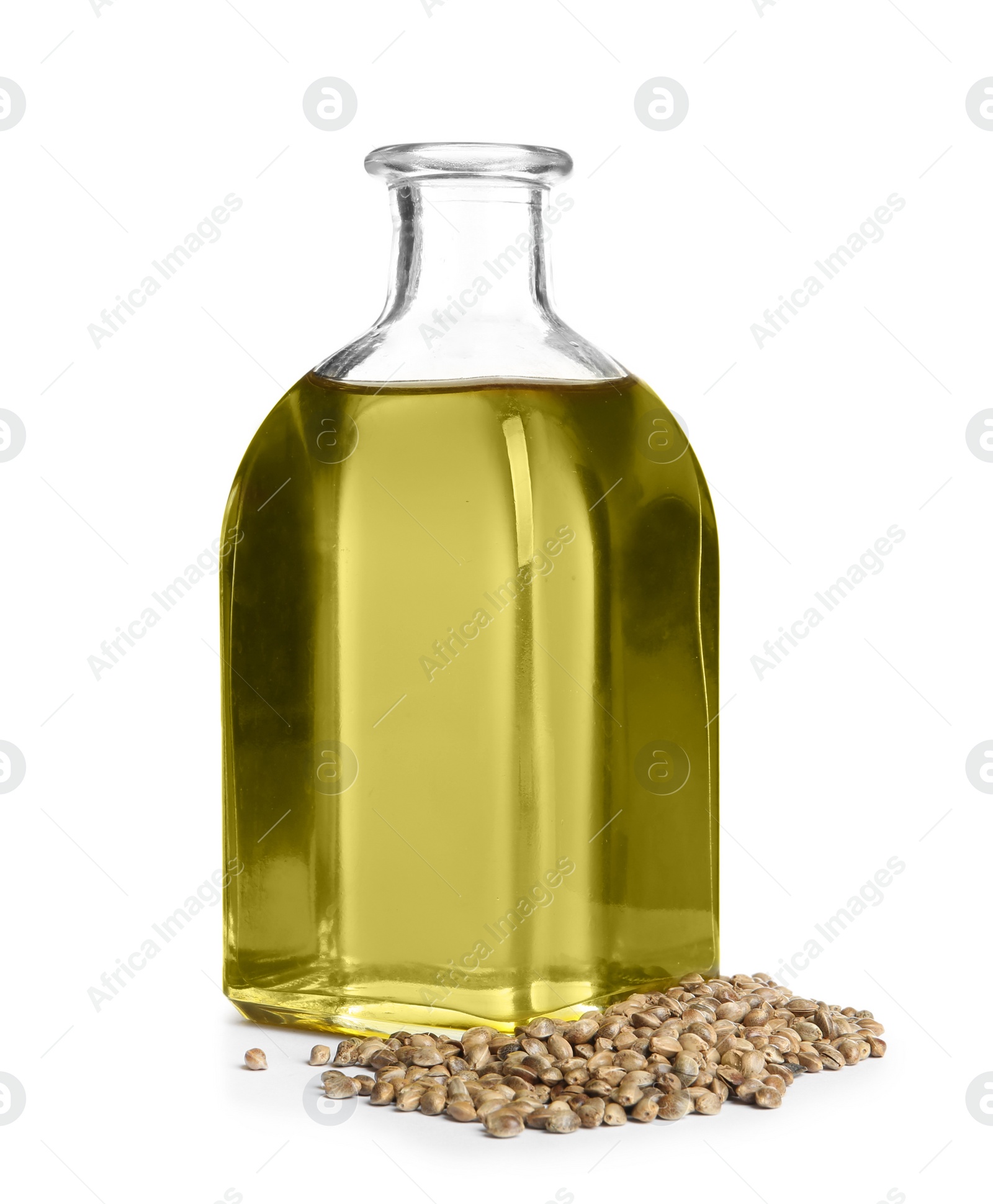 Photo of Bottle with hemp oil and seeds on white background