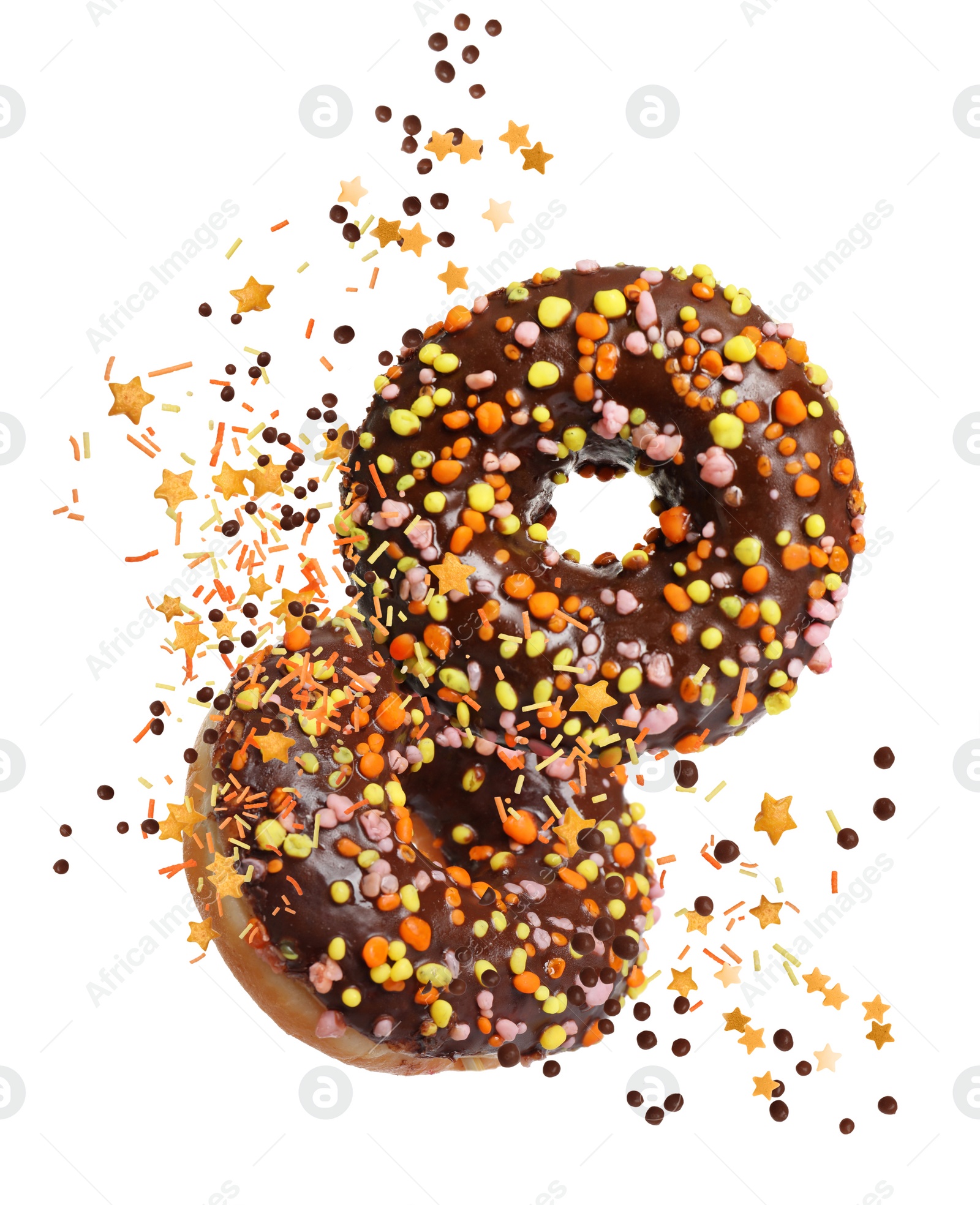 Image of Sweet delicious donuts falling on white background