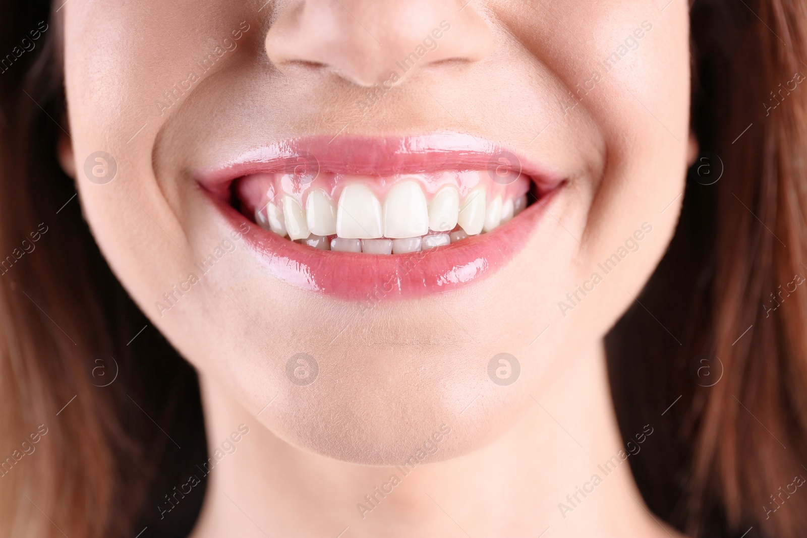 Photo of Young smiling woman with healthy teeth, closeup