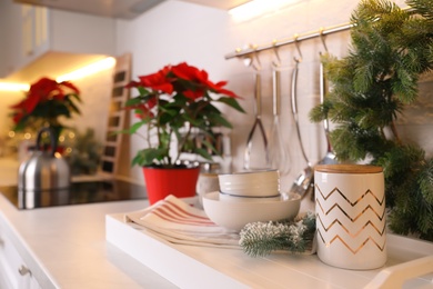 Photo of Set of kitchenware and Christmas decor on countertop indoors