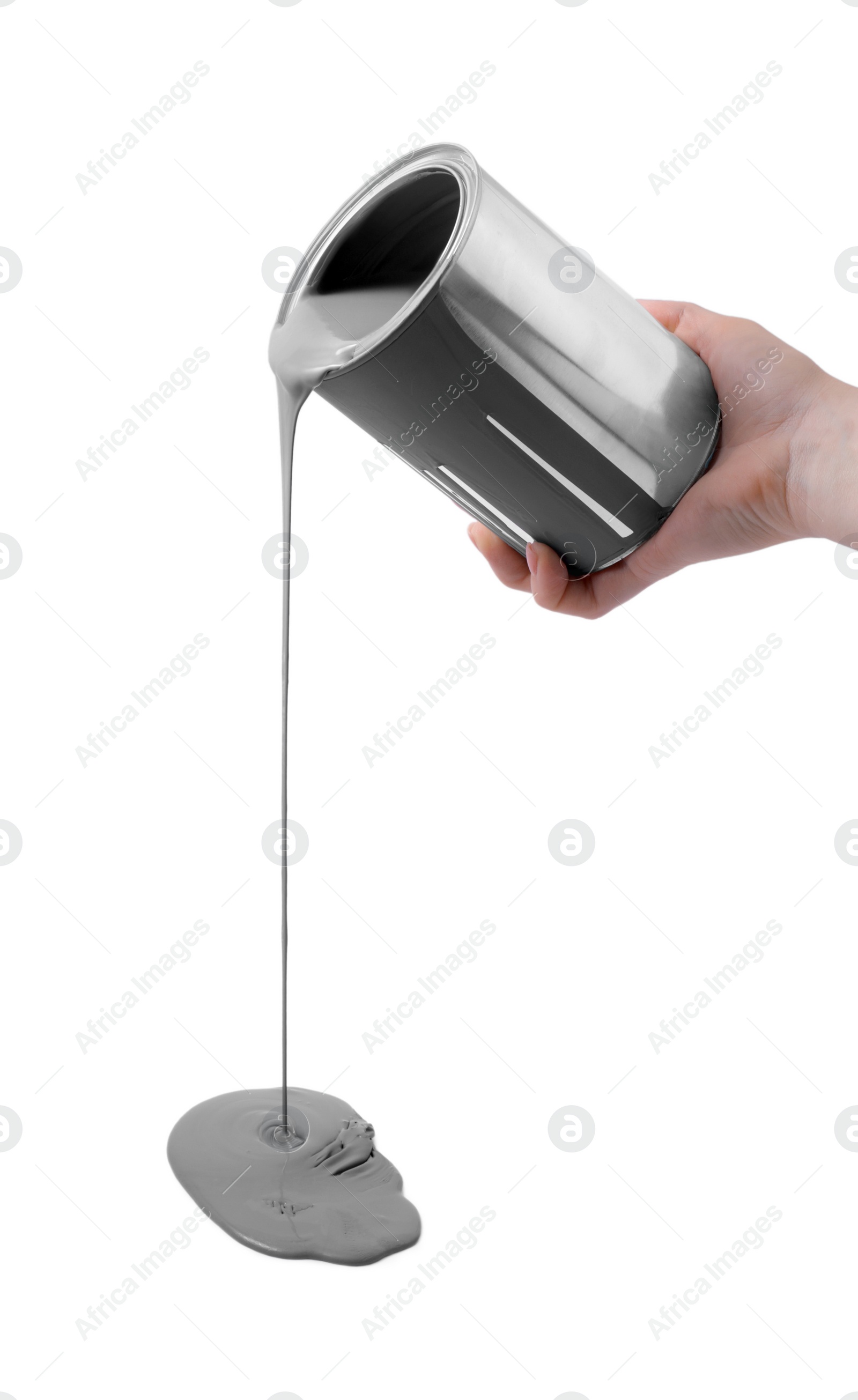 Photo of Woman pouring grey paint from can on white background, closeup